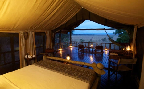 Evening view from a tented room at Katavi Wildlife Camp with private deck and wilderness atmosphere